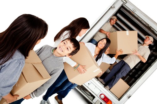 Loading furniture into a van for a Finchley relocation