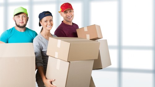 Loading household items into a van for a Finchley move