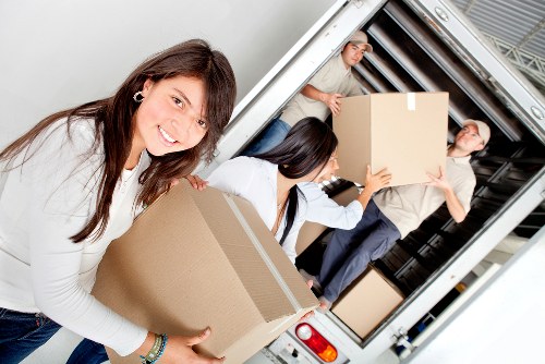 Packed moving boxes and household items prepared for truck hire in Finchley